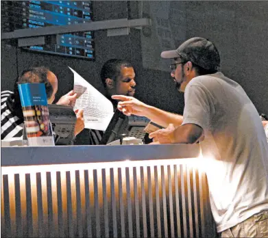  ?? WAYNE PARRY/AP ?? A gambler makes a sports bet on Sept 5, 2019, at Bally's casino in Atlantic City, N.J.