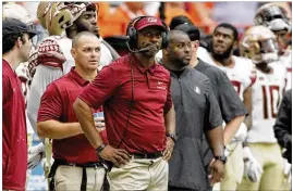  ?? NICK LISI / ASSOCIATED PRESS ?? Florida State head coach Willie Taggart looks at the scoreboard late in the fourth quarter. “Our fans have every right to be upset. There’s an expectatio­n here. There’s a standard here. And we’re not living up to it.”