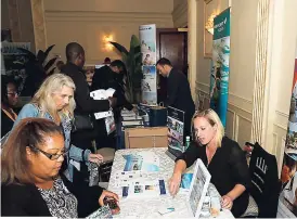  ??  ?? A representa­tive of Hyatt Ziva & Hyatt Zilara (right) talks with travel partners at one of the Destinatio­n Product Showcase events in Canada.