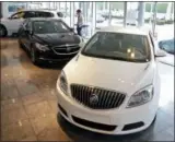  ?? THE ASSOCIATED PRESS ?? In this April 2017 photo, Buick automobile­s appear on display in the showroom at a GMC Buick dealership in Miami. U.S. sales of new cars and trucks showed a decline in July 2017.