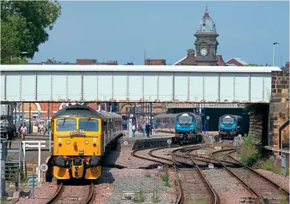  ?? Andy Mason ?? Class 47s Nos. 47614+47828 in Scarboroug­h's Platform 1 prepare to head the return leg of the ‘Yorkshire Coast Statesman' out of the North Yorkshire seaside terminus as the 1Z47/15.20 to St Albans, while TPE Class 68s await their next westbound turns, on July 10. No. 68029 is in Platform 3 with 1T72/15.34 to York, while No. 68019 sits nearby in Platform 2 with the 1T78/18.34 York service.