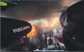  ?? (Pic: Kevin Darwish) ?? Dramatic interior footage of the engine fire of the Ford Mustang RTR last week.