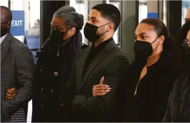  ?? Charles Rex Arbogast / Associated Press ?? Actor Jussie Smollett (center), who is accused of lying about an attack to police, arrives with his mother Janet (left) and other family members at the courthouse for the second day of his trial in Chicago.