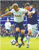  ??  ?? Tottenham striker Harry Kane (left) controls the ball under pressure from Everton defender Michael Keane during Saturday’s English Premier League match at Goodison Park. – AFPPIX