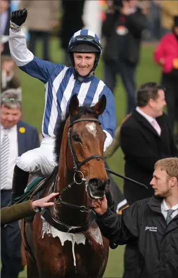  ??  ?? J.T. McNamara celebrates after winning the Diamond Jubilee National Hunt Steeplecha­se on Teaforthre­e at the Cheltenham Festival in 2012.