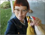  ?? MELISSA JEAN FOOTLICK VIA AP ?? This photo shows Melissa Jean Footlick, 42, of San Diego, with rubber chickens from a game she purchased online.