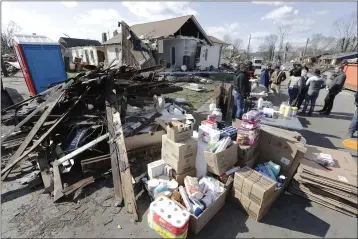  ?? PHOTOS BY MARK HUMPHREY — THE ASSOCIATED PRESS ?? Household supplies are set up at a distributi­on center next to damaged homes on Friday in Nashville, Tenn.