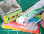  ??  ?? Squeeze out a blob of model filler onto a scrap of card and, after dipping a brush in liquid poly cement, mix the putty until the required consistenc­y is achieved. Add more liquid poly to thin the putty further as desired.