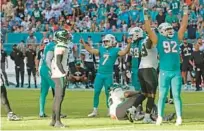  ?? JOHN MCCALL/SOUTH FLORIDA SUN SENTINEL ?? Miami Dolphins kicker Jason Sanders gestures after kicking a field goal against the New York Jets late in the fourth quarter at Hard Rock Stadium in January in Miami Gardens.