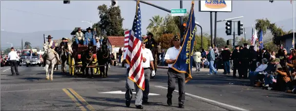 ?? RECORDER File PHOTO ?? In this file photo the American Legion Post 20 Color Guard leads the way in last year’s Veterans Day Parade.