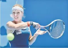  ?? — AFP photo ?? Dominika Cibulkova of Slovakia hits a return to Laura Siegemund of Germany during their women’s singles first round match at the Sydney Internatio­nal tennis tournament in Sydney.