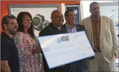  ?? WILLIAM ROLLER PHOTO ?? FROM LEFT: Alex Martinez, AT&T store manager; Christine Moore, AT&T director of external affairs; Alex Cardenas, executive director of Court Appointed Special Advocates of Imperial County, El Centro Mayor Jason Jackson; and Julio Figeuroa, AT&T...