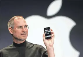  ?? PAUL SAKUMA/AP ?? Steve Jobs, the late Apple CEO, introduces the first iPhone in 2007.