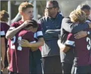  ?? DAVID M. JOHNSON - DJOHNSON@DIGITALFIR­STMEDIA.COM ?? Burnt Hills-Ballston Lake seniors console each other after being defeated by Queensbury in the Section II Class A Championsh­ip Saturday at Colonie High School.