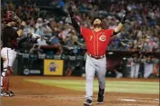  ?? ASSOCIATED PRESS ?? CINCINNATI REDS’ EUGENIO SUAREZ celebrates after hitting a solo home run against the Arizona Diamondbac­ks in the fourth inning during Sunday’s game in Phoenix.