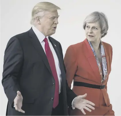  ??  ?? 0 By tying herself to Donald Trump, Theresa May has created a potentiall­y damaging hostage to fortune