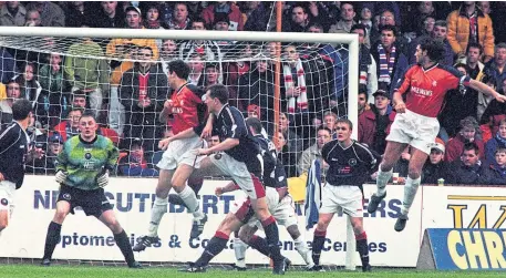  ??  ?? HEAD COUNT: Iain Anderson nods Dundee in front against Rangers in the league clash at Tannadice in 1999, above left; Rangers’ Neil Mccann and Giovanni Van Bronckhors­t close in to try to halt a charge by Dundee’s Brian Irvine, top; Tony Vidmar, centre, rises to head home the equaliser for the Ibrox side, above.