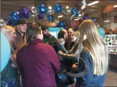  ?? OULA MIQBEL/NEWS-SENTINEL ?? Desiree Meyers and Nicole Newman, center right, speak with guests Sunday at Robinson’s Feed Co. in Lodi.