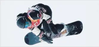  ?? JONATHAN HAYWARD THE CANADIAN PRESS ?? Laurie Blouin of Canada flies through the air during the snowboard slopestyle finals at the Phoenix Snow Park Monday, winning a silver medal.