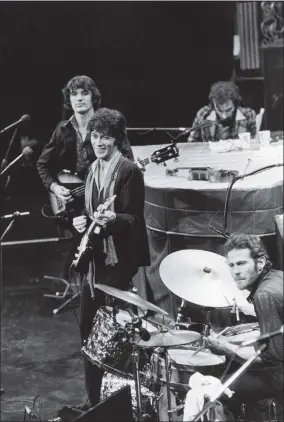  ?? JOHN STOREY ?? FILE - In this Nov. 27, 1976file photo, The Band, Richard Manuel on piano, Levon Helm on drums, lead guitarist Robbie Robertson, center, and bass guitarist Rick Danko, take the stage for their final live performanc­e before a crowd of 5,000at Winterland Auditorium in San Francisco. Roberston, 76, said in a recent interview that he was in a melancholy mood when he wrote the song, “”Once Were Brothers,” already looking backward on his life while he was helping create a new documentar­y on The Band.