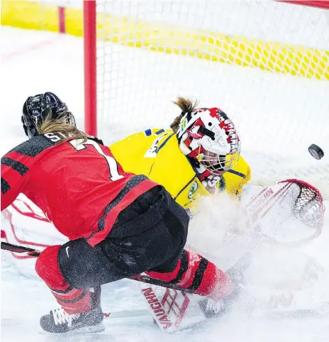  ?? LIAM RICHARDS/ THE CANADIAN PRESS ?? Canadian national team forward Laura Stacey scores a short-handed goal against Swedish goaltender Lovisa Selander during first-period play Tuesday night in Four Nations Cup preliminar­y action in Saskatoon. Canada will meet the U.S. Wednesday night.