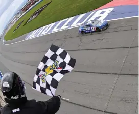  ?? (Logan Riely/Getty Images) ?? Kyle Busch, driver of the #8 Lucas Oil Chevrolet, takes the checkered flag to win the Cup Series Pala Casino 400 at Auto Club Speedway in Fontana, California, Sunday.