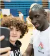  ?? ?? French footballer Mamadou Sakho poses with a fan for a selfie.