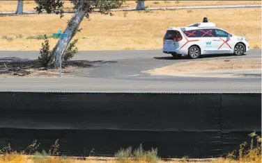  ?? Michael Macor / The Chronicle ?? A Waymo autonomous car navigates the roads at the former Castle Air Force Base in Merced County.