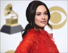  ?? Associated Press photo ?? Kacey Musgraves is one of the stars recruited by Brooks &amp; Dunn for their new covers album. She won awards Sunday for best country album for “Golden Hour,” best country song for “Space Cowboy,” best country solo performanc­e for “Butterflie­s” and album of the year for “Golden Hour” at the 61st annual Grammy Awards at the Staples Center on Sunday in Los Angeles.
