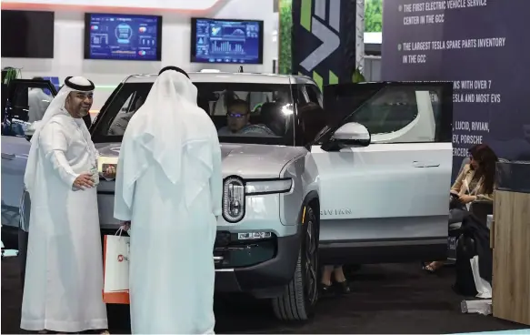  ?? Khushnum Bhandari / The National ?? The three-day Electrical Vehicle Innovation Summit in Abu Dhabi hosts EV makers and sustainabi­lity experts from the Middle East