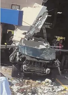  ?? PHOTO BY WILLIAM HILARIO/HILARIO AUTO SALES ?? CARNAGE: A still image from a video by Lynnway Auto Auction attendee William Hilario shows a vehicle that smashed through the wall of the garage at 400 Charter Way in Billerica.