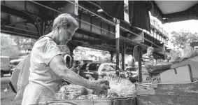  ?? Desiree Rios/New York Times ?? A woman shops for produce in the Bronx. The Federal Reserve’s preferred inflation gauge climbed rapidly in June.