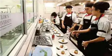  ??  ?? Taylor’s Advanced Diploma in Patisserie and Gastronomi­c Cuisine students preparing the amuse bouche to be served to the guests.