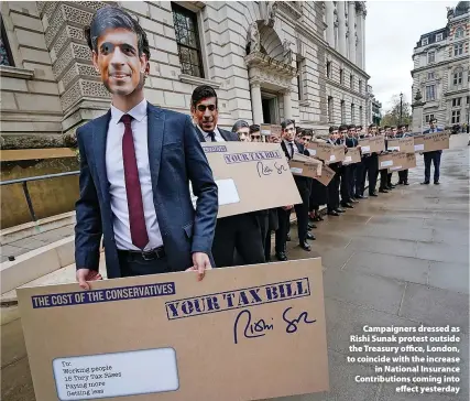  ?? Yui Mok ?? Campaigner­s dressed as Rishi Sunak protest outside the Treasury office, London, to coincide with the increase in National Insurance Contributi­ons coming into effect yesterday