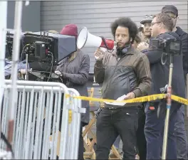  ?? LAURA A. ODA — STAFF PHOTOGRAPH­ER ?? Boots Riley yells directions on Franklin Street on Friday. Riley is making his directoria­l debut, shooting scenes throughout Oakland for the drama, “Sorry to Bother You.”