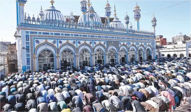  ?? Agence France-presse ?? People offer first Friday prayers during the month of Ramadan at a mosque in Rawalpindi.