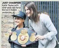  ??  ?? JUST CHAMPION Katie Taylor with nine-year-old Ilaria Borza in Dublin yesterday