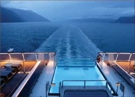  ?? PHOTO FOR THE WASHINGTON POST BY NEVIN MARTELL ?? Watching the wake off the stern of the Viking Jupiter on a summer cruise from Norway to the Netherland­s.