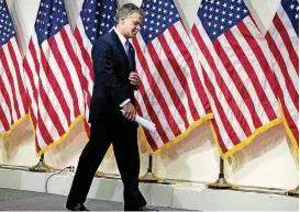  ?? [AP PHOTO] ?? FBI Director Christophe­r Wray leaves after speaking at a news conference Thursday on the inspector general’s report at FBI headquarte­rs in Washington.