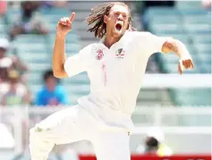  ?? — AFP photo ?? Andrew Symonds leaping high in the air after dismissing Indian batsman Rahul Dravid during the fourth day of the first Test match at the MCG in Melbourne in this Dec 29, 2007 file photo.