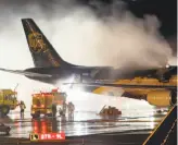  ?? Joseph Kaczmarek / Associated Press 2006 ?? Firefighte­rs battle a 2006 blaze on a UPS cargo plane in Philadelph­ia. The Internatio­nal Civil Aviation Organizati­on says lithium ion batteries on planes can be a fire hazard.