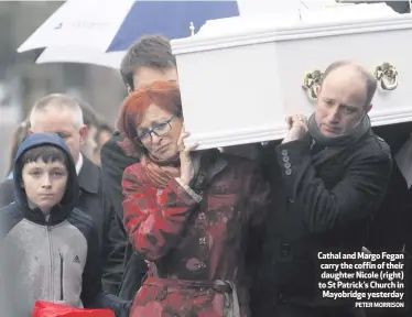  ?? PETER MORRISON ?? Cathal and Margo Fegan carry the coffin of their daughter Nicole (right) to St Patrick’s Church in Mayobridge yesterday