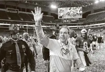  ?? Kevin C. Cox / Getty Images ?? Coach Nick Saban acknowledg­es fans as he leaves the field at Hard Rock Stadium in Miami Gardens, Fla., having delivered Alabama its sixth national championsh­ip in the past 12 seasons.