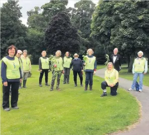  ??  ?? Balsam blitz Crieff Soroptimis­ts helped Jim Anderson of Crieff Community Trust clear invasive plants at Turretbank Wood