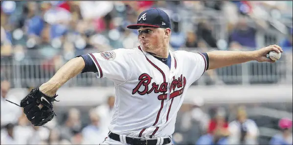  ?? JOHN BAZEMORE / AP ?? In his major league debut Saturday, starting pitcher Sean Newcomb throws a gem, going 6⅓ innings while giving up one unearned run and four hits to the Mets at SunTrust Park. The Mets hammered the Braves bullpen for a 6-1 win in the first game of a...