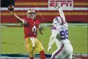  ?? RICK SCUTERI — THE ASSOCIATED PRESS, FILE ?? Nick Mullens throws over the Bills’ Harrison Phillips (99) on Dec. 7 in Glendale, Ariz. The 49ers’ 2020 passing leader may not play in 2021 because of his recent elbow surgery.