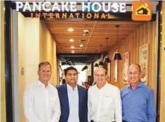  ??  ?? From left: Peter King, CEO, Max’s Group Inc, Sajan Alex, Vice President, Tablez Food Company, Robert Trota and William E. Rodgers, Director and Head of Internatio­nal Business.