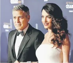  ??  ?? The donation comes from the Clooney Foundation for Justice, which George (left) and Amal establishe­d in 2016 to promote justice in classrooms and courtrooms around the world.