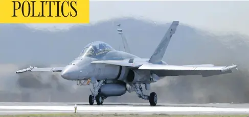  ?? CARLA GOTTGENS / BLOOMBERG ?? The Liberal government’s plan to purchase 18 Super Hornet fighter jets from Boeing is being reviewed after the company complained to the U.S. government that Canadian aerospace firm Bombardier is receiving subsidies, allowing it to sell its C-Series...