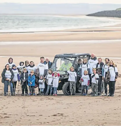  ?? Pictures: Kris Miller. ?? Volunteer litter pickers on Carnoustie beach as part of the Great Angus Beach Clean and, below, David and Anna Peebles doing their bit for the environmen­t.